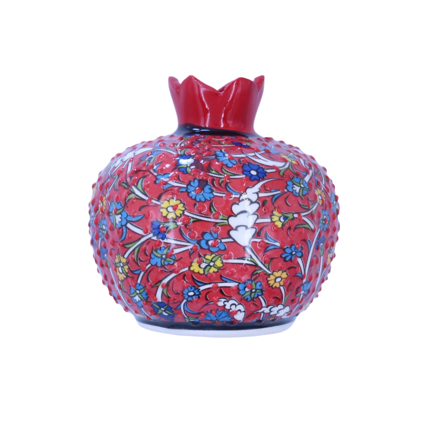 Decorative ceramic pomegranate with floral pattern on a light blue background