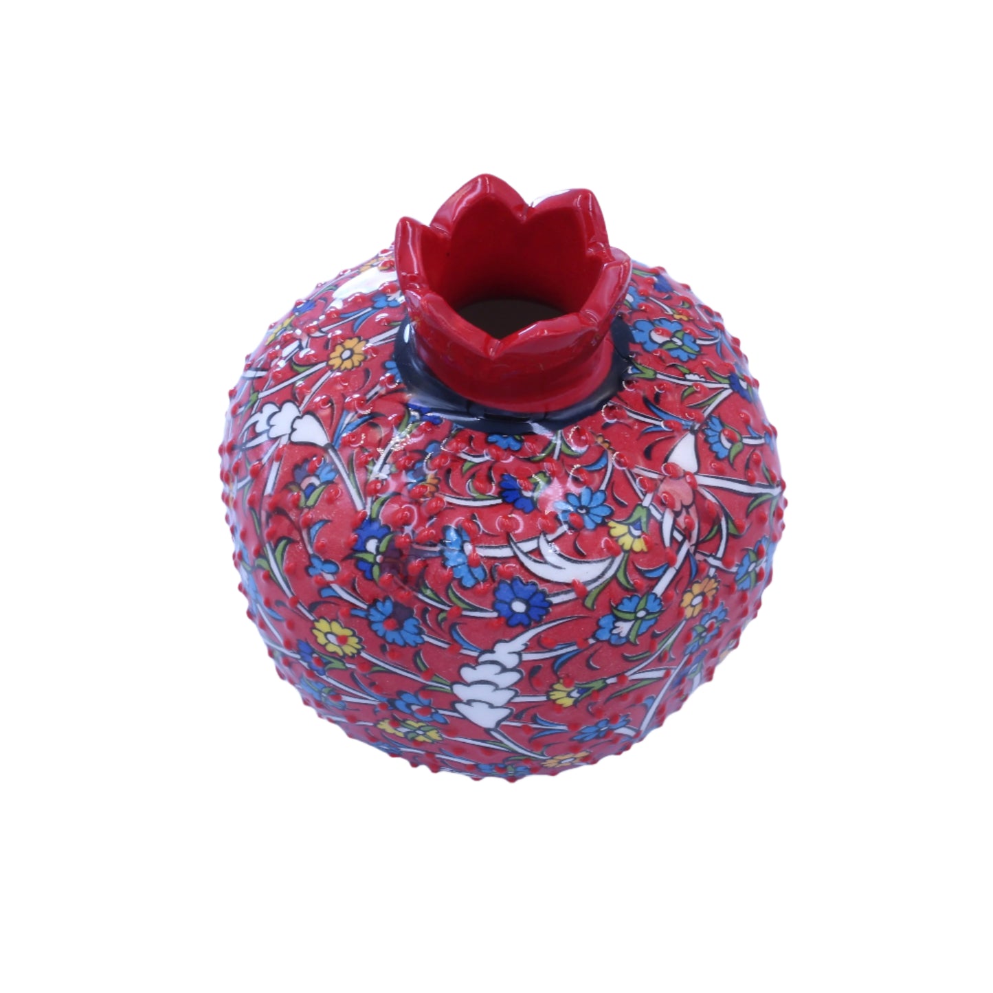 Decorative red vase with floral patterns on a light blue background