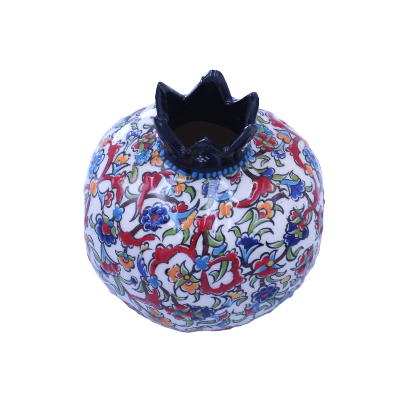 Decorative Ceramic pomegranate with colorful patterns on a light blue background