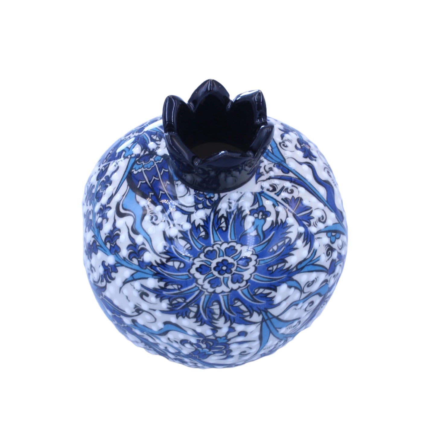 Decorative ceramic pomegranate with blue floral patterns on a light blue background