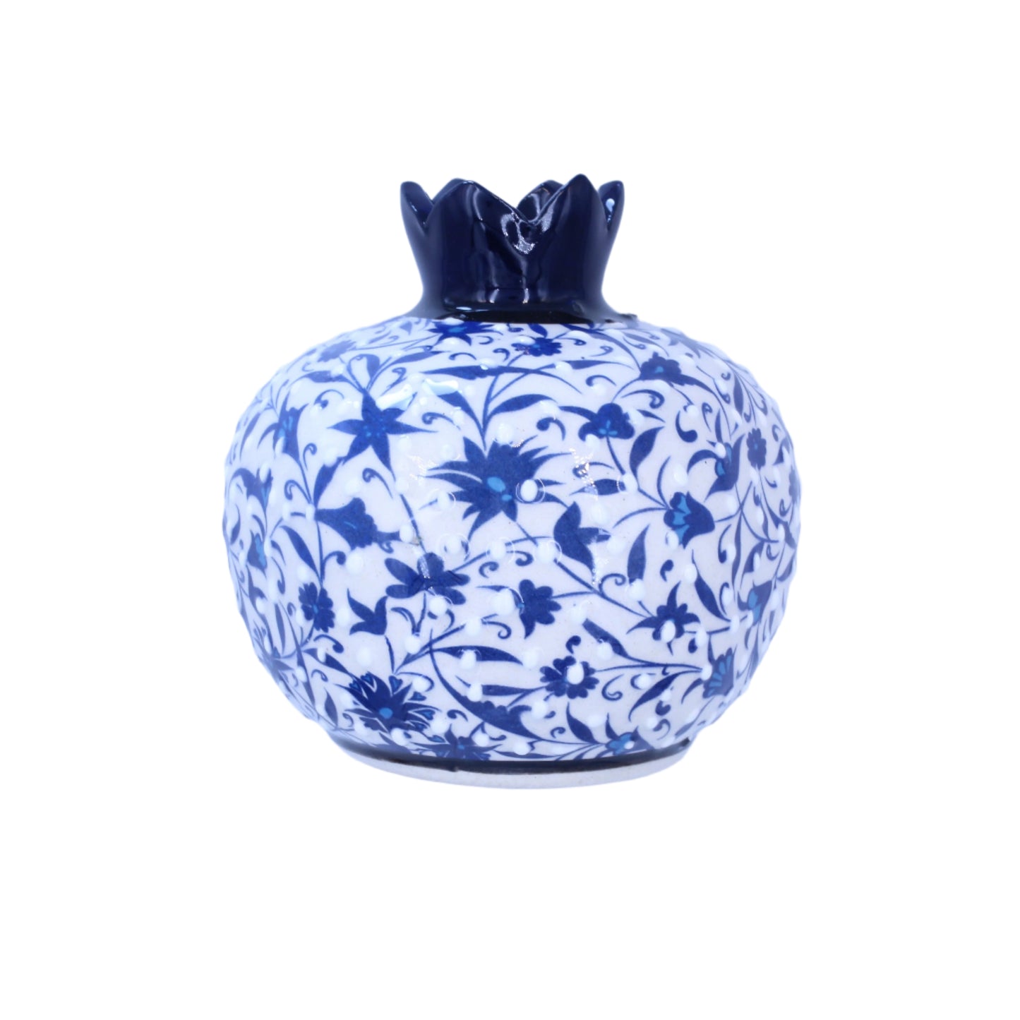 Decorative ceramic pomegranatewith blue floral patterns on a light purple background